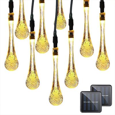 China Commercial Wholesale 7M 30 Use LED Solar Led Christmas Light Outdoor Waterproof Fairy Lights Scallop New Year Water Drops Led String Light for sale