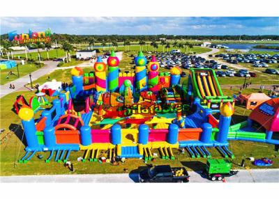 China Giant Outdoor Rainbow Castle Theme 1500W Inflatable Fun Land for sale