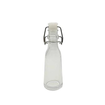 China ECO 2oz 50ml Mini Glass Bottle Alcohol Drink Wine Whiskey Bottle With Clip Lid Miniature Bottle For Popular Spiritsmost Glass for sale