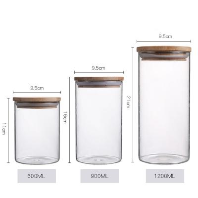 China Eco-freindly factory supply fashion glass food storage jar for kitchen use with bamboo lid for sale