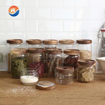 China Eco-freindly Varied Capacity Glass Storage Jar With Classic Wooden Lid for sale