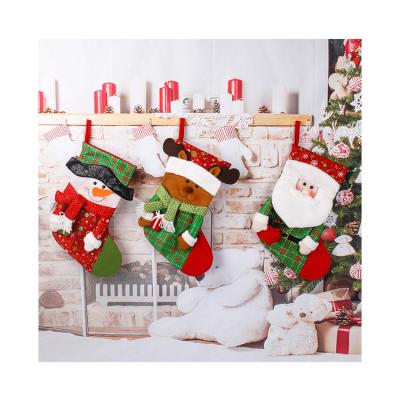 China Polyester Wholesale Merry Christmas Stocking Santa Socks Festival Present Home Decoration Styles Party Ornament For Kid Gift for sale