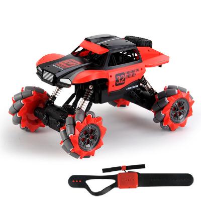 China Auto Return 2.4G four-wheel drive climbing off-road electric watch wireless charging lateral drift stunt remote control toy car for sale