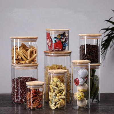 China Customized Sustainable Square Borosilicate Glass Storage Jar With Lid Bamboo Wooden Food Glass Jar for sale