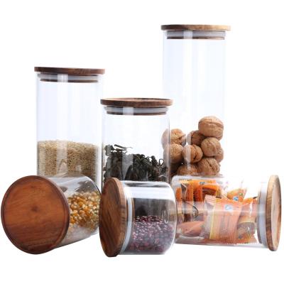 China Sustainable High Borosilicate Glass Storage Jar With Lid Wooden Kitchen Food Container For Coffee Bean Or Tea for sale