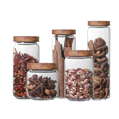 China Amazon Food Jar Grain Storage Box Glass Tea Jar Kitchen Storage Viable Hot Selling Sealed Glass Jar With Wooden Lid for sale