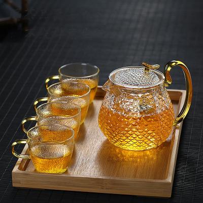 China Sustainable High Borosilicate Glass Teapot Filter Bubble Teapot Househol Hammer Pattern Teapot Set for sale