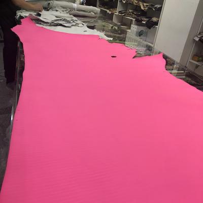 China Fluorescent chrome piece cowhide free leather skin viable pink cowhide half leather for making shoes or bags for sale