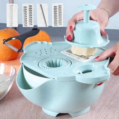 China Multi-function kitchen whole stocked vegetable and mini marvel of fruit magic grater7 in 1 kitchen gr cup, draining, juicing grinder for sale