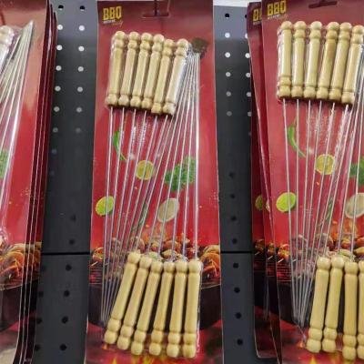 China Wholesale Various Easily Cleaned Round And Flat Stainless Steel BBQ Spits Barbecue Stickers BBQ Forks And Knife With Wooden Handle for sale