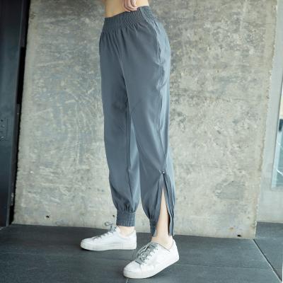 China High Waist Sporty Jogging Loose Jogging Yoga Pants Women High Waisted Side Pocket Sports Leggings Sweatpants Yoga Pants for sale