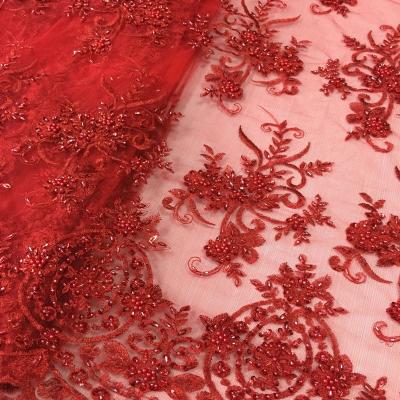 China New Style Red Beaded Lace Fabric Hand Embroidery Designs Shrink-Resistant For Wedding Dress Or Party for sale