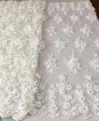 China Shrink-resistant bridal lace 3d beaded lace fabric high quality hand beaded stones 3d lace applique embroidered fabric for wedding dress for sale