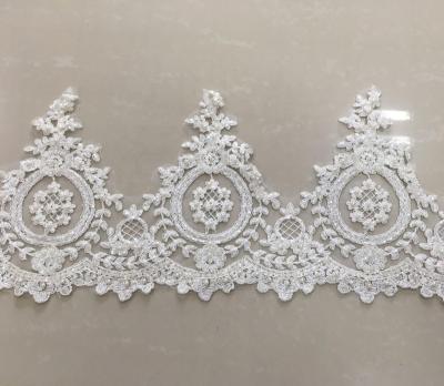 China Shrink-Resistant Beaded Cord Lace Trim In Off White Color Wholesale High Quality Border Lace Fabric for sale