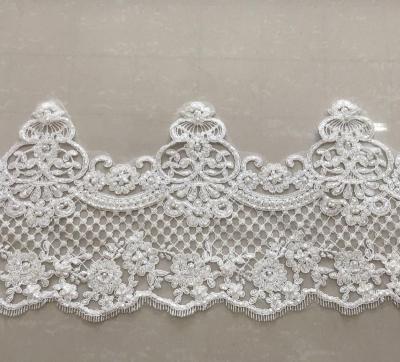 China Bestseller Shrink-Resistant off-white embroidered beaded tied border lace trim for dress or garment, in stock for sale for sale