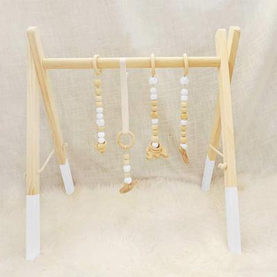 China Toy Montessori Nordic Style Natural Educational Soft Rattan Wooden Inflatable Play Gym Frame For Kids Activity Gym Hanging Toy Newborn Gift for sale