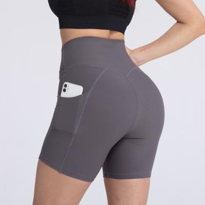 China Cross Women Breathable Ribwork Fitness High V Waisted Yoga Shorts With Pockets for sale