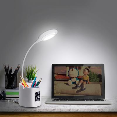 China Shenzhen Residential Eye Production Led Reading Light With Pen Phone Holder Cordless Table Lamp for sale