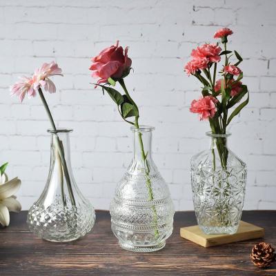 China Decorative embossed glass vase in contemporary handcrafted glass flower vase technique decor for sale