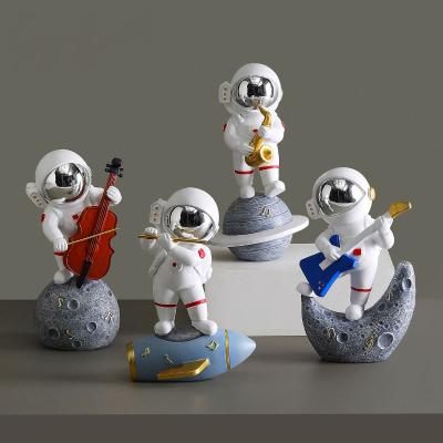 China Factory Supply Eco-friendly Creative Band Astronauts Pose Arts And Crafts Resin Home Office Decoration for sale