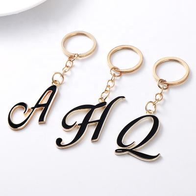 China Customized contemporary and contracted word letters key chain men gold metal decoration key chain pendant ring for sale