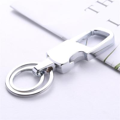 China Hot Selling Multifunctional Double Ring Keychain Personalized Metal Souvenir Key Chain Leye Bottle Opener Design for sale