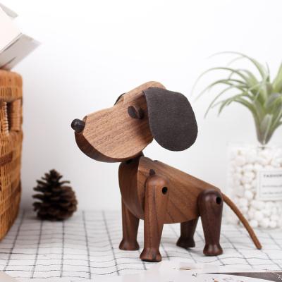 China Europe Danish Decoration Hand Carved Walnut Wood Dog Crafts Wooden Animal Carvings Arts And Crafts for sale