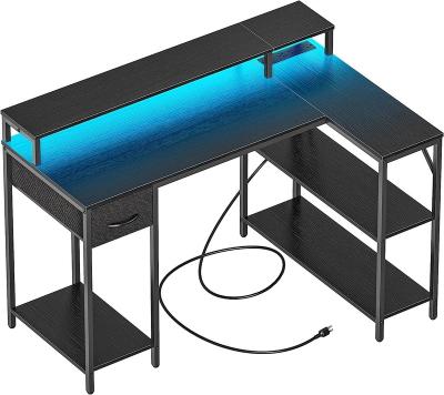 China Convertible L Shaped Gaming Desk with LED Lights & Power Outlets, Reversible Computer Desk with Shelves & Drawer, for sale