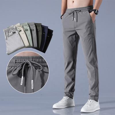 China Anti-wrinkle summer pants men's thin casual spring Quick-drying loose ice silk new sports pants men's trend summer trousers for sale