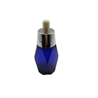 China 1oz 2oz 4oz Polyhedron High Quality Cosmetic Blue Irregular Essential Oil Bottle Aluminum Dropper PTG Bottle for sale