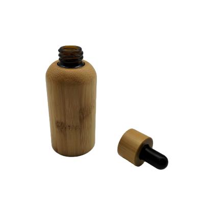 China 1oz 2oz 4oz Cosmetic Packaging 30ml 60ml 120ml Glass Bottles Essential Oil Bamboo Cosmetic Bamboo Bottle for sale