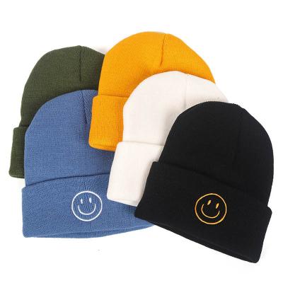 China 2021 Fashion COMMON Embroidery Winter Beanie Hat Smiling Men Women Knitted Hat Winter Arctic Caps for sale