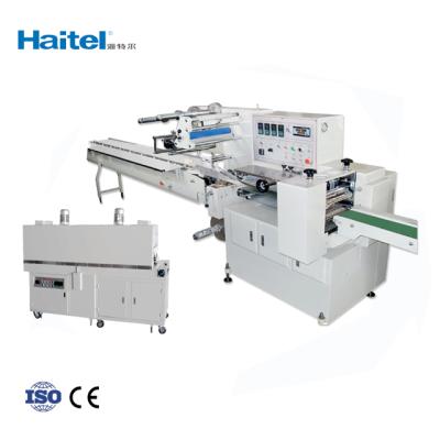 China Food Heat Shrink Packing Machine Haitel Dual Servo Multifunctional Packing Machine for sale