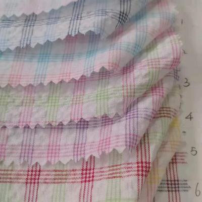 China Breathable cheap price cotton yarn dyed plaids stripes cotton seersucker woven fabric for kids shirts dress clothing for sale