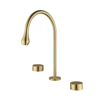 China Newest Modern Design Gold Split Deck Mounted Brass Hot Cold Water Faucet Mixed Three Hole Two Handle Bathroom Basin Faucet for sale