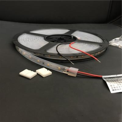 China Residential CE ROHS Approved Flexible LED Strips 6W DC24V Warm White Strips 2835 Chips 60pcs Per Meter IP65 for sale