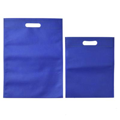 China Eco-friendly Wholesale Custom Logo Cheap Reusable Handled Style Non-woven Material Die Cut Handle Tradeshow d cut non woven bag for sale