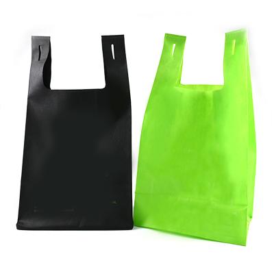 China Eco-friendly Custom Size Supermarket Tote Non Woven Vest Shopping Bags Non Woven Fabric Biodegradable T-Shirt Bag With Logo for sale