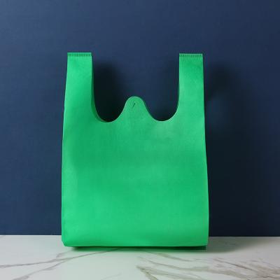 China Eco-friendly Custom multipurpose ultrathin many colors non woven vest shopping bag custom printed non woven t- shirt bag u cut for sale