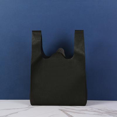 China Eco-friendly Wholesale multipurpose custom w u cut non woven bag non-woven fabric portable T-shirt clothes bag for sale