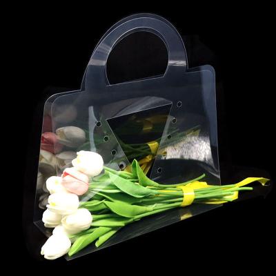 China Recyclable Tiktok hot selling PVC transparent bouquet bag florist supplies packaging custom logo waterproof clear plastic flower carry bags for sale