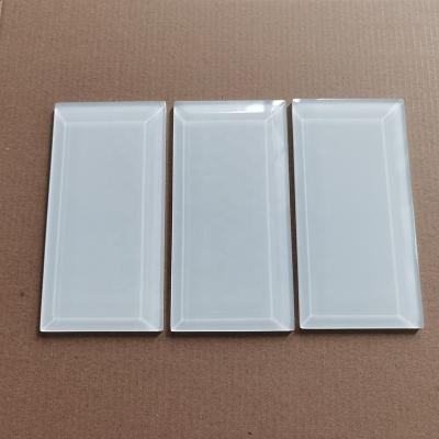 China Super White Beveled Parquet Edge Subway Glass Slabs for sale