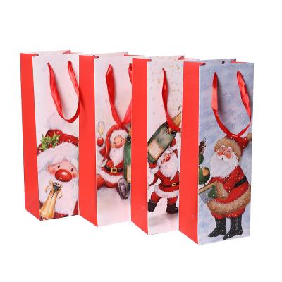 China Wholesale Luxury Eco - Friendly Recyclable Gift Packaging Merry Christmas Logo Printed Paper Bag With Handle for sale