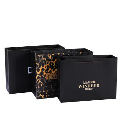 China Recyclable Black Paper Bags Can Be Reused With Custom Logo High End Clothing Shopping Bags for sale