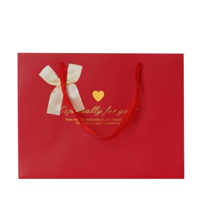 China Recyclable Wholesale Cheap Red Chinese Wedding Cardboard Paper Boutique Gift Bags For Holidays for sale