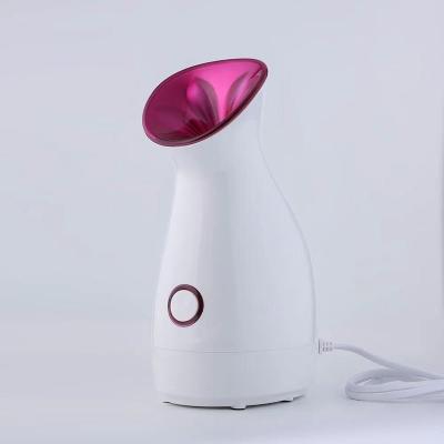 China Moisturizer Cosmetics Handheld Nano Spray Electric Face Steamer for sale