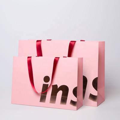 China Christmas Recyclable Pink Ribbon Paper Bag Custom Logo Printed Package For Gift for sale