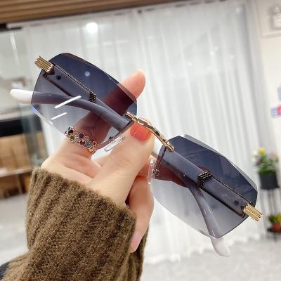 China Fashion Sunglasses Women Vintage Diamond Cut Ocean Lens Sun Glasses Rimless Small Rectangle Marbling Temples Sunglasses for sale