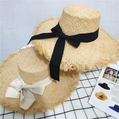 China New Summer Beach Raffia Straw Hat Black White Ribbon Sun Hat Women Sea Beach Striped Hat for sale