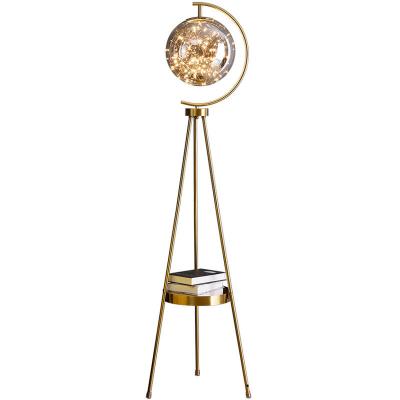 China Nordic minimalist light luxury creative tripod glass ball personality living room bedroom floor lamp vertical table lamp for sale